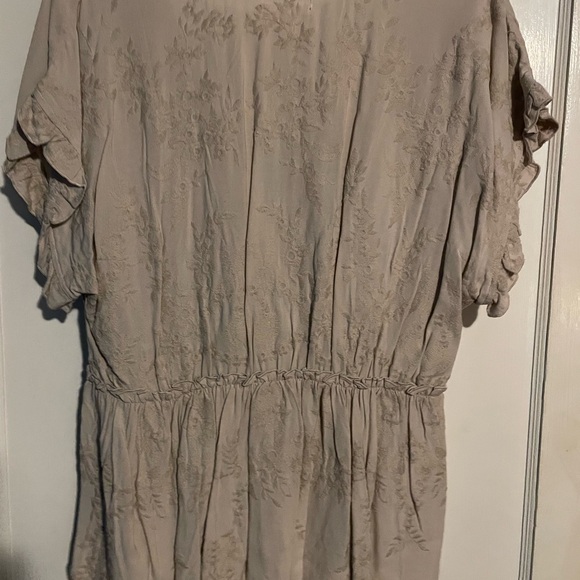 Lightweight floral embossed peplum blouse. Snap at vneck. - Picture 2 of 3